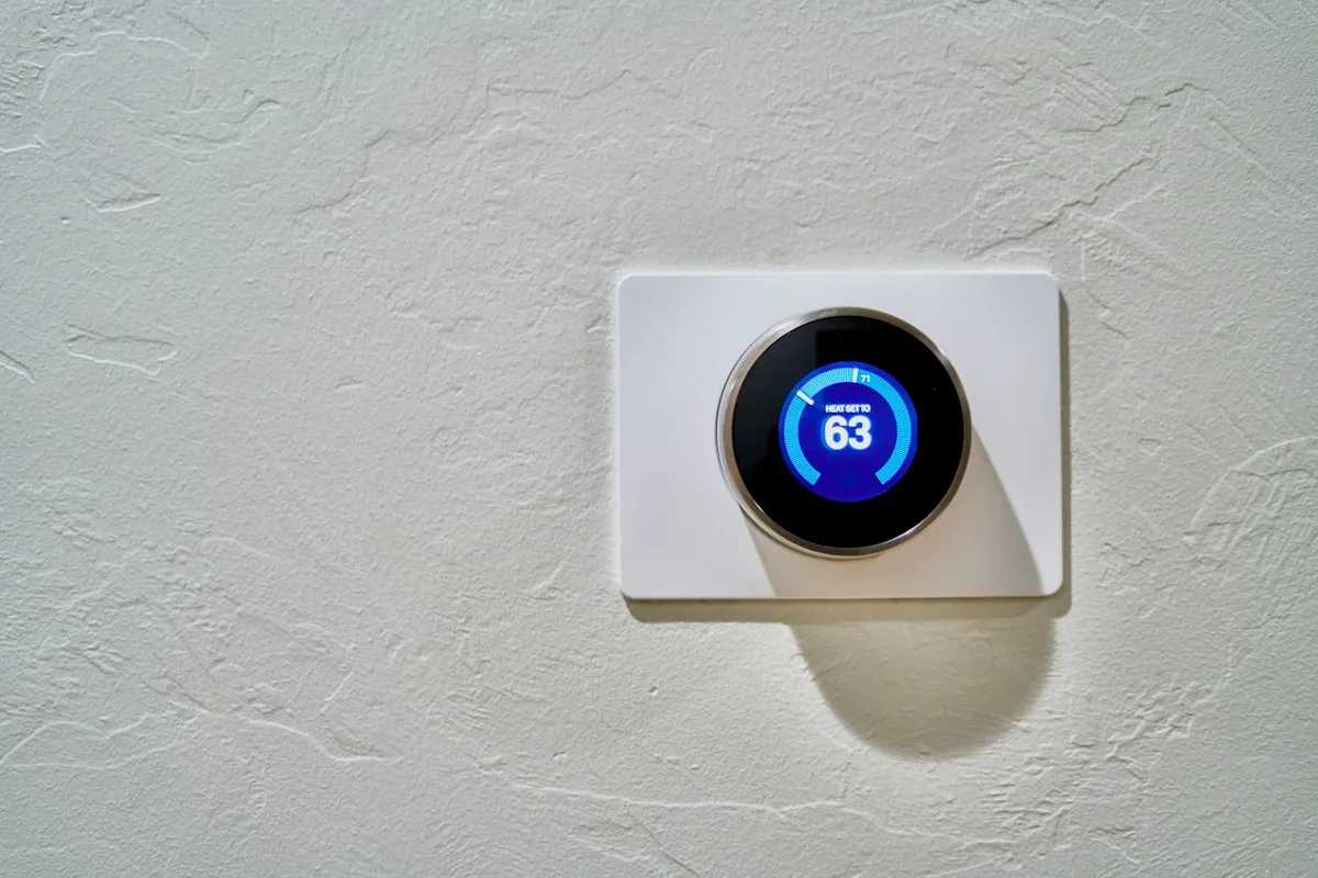 Illustrative wall-mounted home thermostat, a detail of residential temperature control